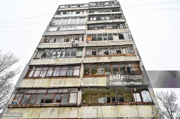 Windows smashed out by the shockwave and debris are being seen at a residential building that is damaged as a result of the Russian missile attack in...