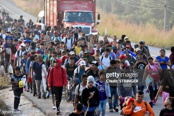 Migrants take part in a caravan towards the border with the United States in Arriaga community, Chiapas State, Mexico, on January 8, 2024. More than...