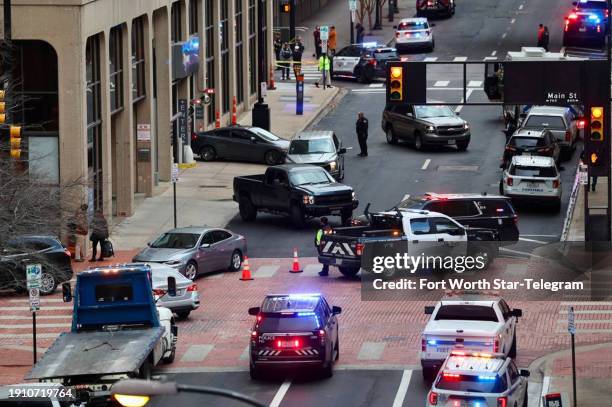 View from 6th Street in downtown Fort Worth, Texas, as firefighters, police and medics respond to an explosion at the Sandman Hotel on Houston...