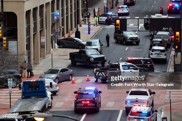 View from 6th Street in downtown Fort Worth, Texas, as firefighters, police and medics respond to an explosion at the Sandman Hotel on Houston...