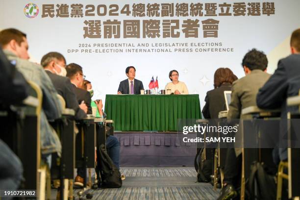 Taiwan's Vice President and presidential candidate of the ruling Democratic Progressive Party Lai Ching-te and his running mate Hsiao Bi-khim hold a...