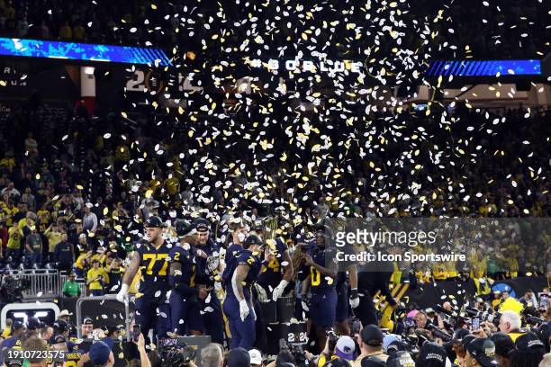 Confetti falls as Michigan celebrates winning the game during the Michigan Wolverines versus the Washington Huskies CFP National Championship game on...