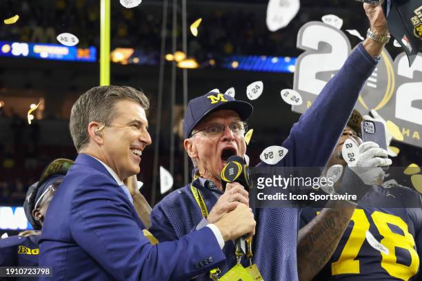 Michigan Wolverines head coach Jim Harbaugh's father Jack Harbaugh screams to Michigan players after they win the CFP National Championship game...