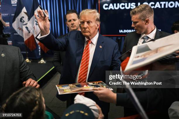 January 6: Former president Donald Trump signs autographs at a campaign rally at Des Moines Area Community College in Newton, Iowa on Saturday,...