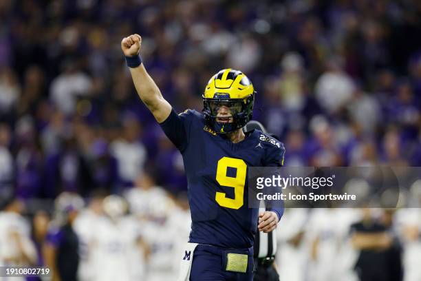 Michigan Wolverines quarterback J.J. McCarthy celebrates after a touchdown during the CFP National Championship against the Washington Huskies on...
