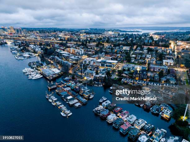 aerial view of houseboats and condominiums along shore - seattle pier stock pictures, royalty-free photos & images