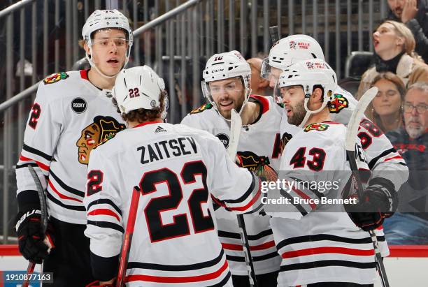 Jason Dickinson of the Chicago Blackhawks celebrates his first period goal against the New Jersey Devils at Prudential Center on January 05, 2024 in...