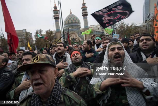 Members of the Basij paramilitary force are beating themselves in a religious ceremony during a military rally in downtown Tehran, Iran, on November...
