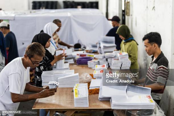 Workers sort out and fold ballot papers at the general elections logistics warehouse in Jakarta, Indonesia on January 9 ahead of Indonesia's upcoming...