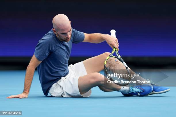 Adrian Mannarino of France reacts after falling during a point in their semi-final match against Hubert Hurkacz of Poland during the 2024 United Cup...