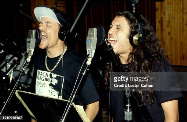 American rapper Ice-T and musician Tom Araya, from the metal group Slayer, record in studio on three songs for the 1993 action-thriller movie...