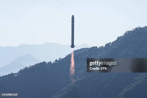 Long March-2C rocket, carrying the Einstein Probe satellite, lifts off from the Xichang Satellite Launch Center in Xichang, in southwestern China's...