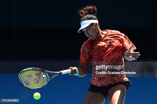 Naomi Osaka of Japan plays a forehand during a training session ahead of the 2024 Australian Open at Melbourne Park on January 06, 2024 in Melbourne,...