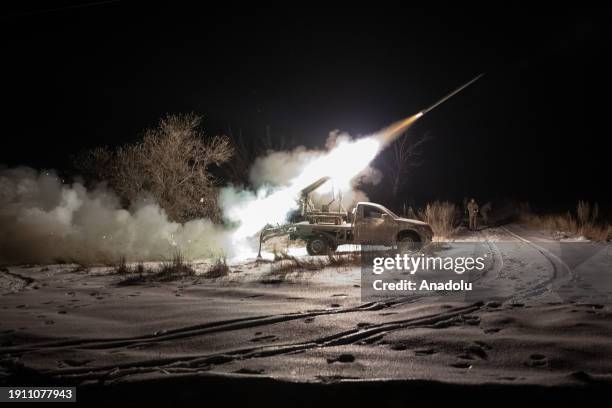 Ukrainian soldiers fire 'Mini Grad' multi-barrel rocket launchers at Russian positions in the direction of Kupiansk, where clashes between Russia and...