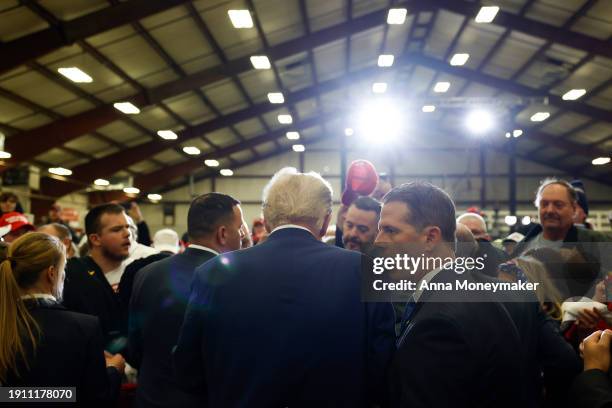 Republican presidential candidate, former U.S. President Donald Trump signs autographs for guests after speaking at a campaign rally on January 05,...