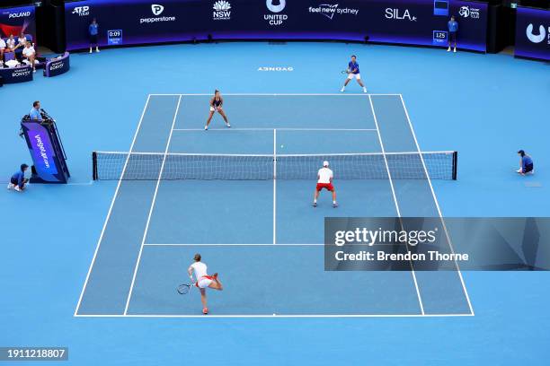 Katarzyna Kawa and Jan Zieliński of Poland compete in their semi-final match against Elixane Lechemia and Édouard Roger-Vasselin of France during the...