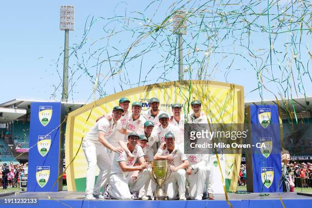 Australia players celebrate with the Benaud-Qadir Trophy after winning the series against Pakistan following day four of the Men's Third Test Match...