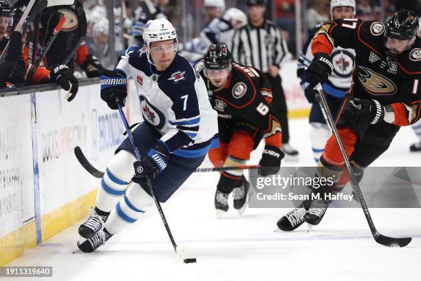 Vladislav Namestnikov of the Winnipeg Jets controls the puck past the defense of Alex Killorn of the Anaheim Ducks during the third period of a game...