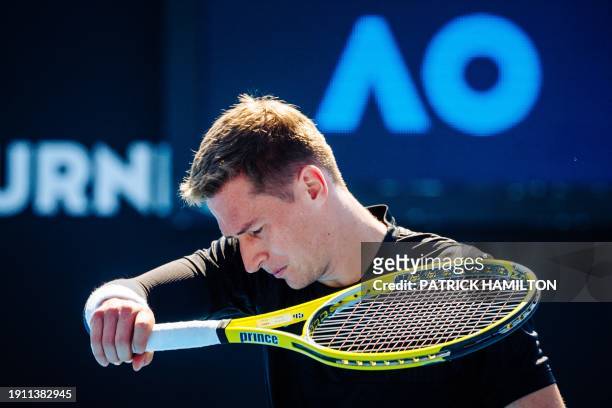 Kimmer Coppejans reacts during a men's qualifying singles first round game between Argentina's Tirante Belgian Coppejans, at the 'Australian Open'...