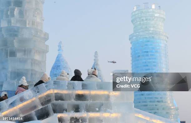 Tourists have fun at the Harbin Ice and Snow World during the 40th Harbin International Ice and Snow Festival on January 5, 2024 in Harbin,...