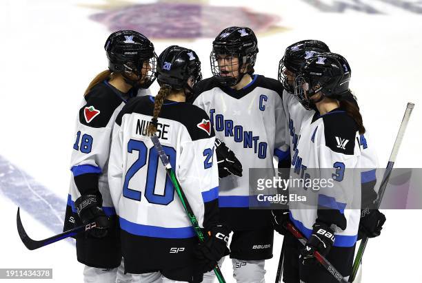 Blayre Turnbull of Toronto talks with teammates Jesse Compher,Sarah Nurse and Jocelyne Larocque before the opening face off against New York at Total...