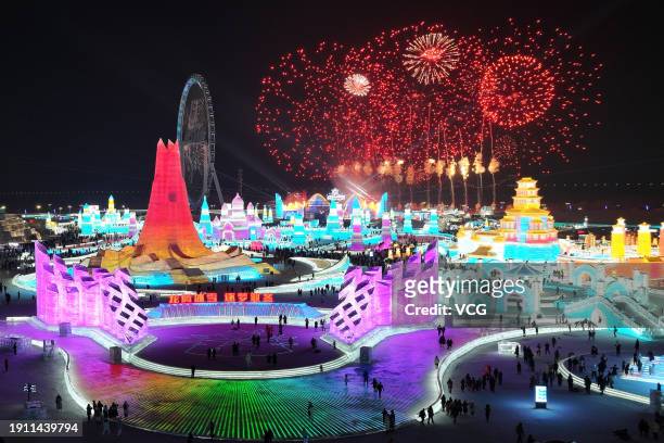 Fireworks light up the sky over the Harbin Ice and Snow World during the 40th Harbin International Ice and Snow Festival on January 5, 2024 in...