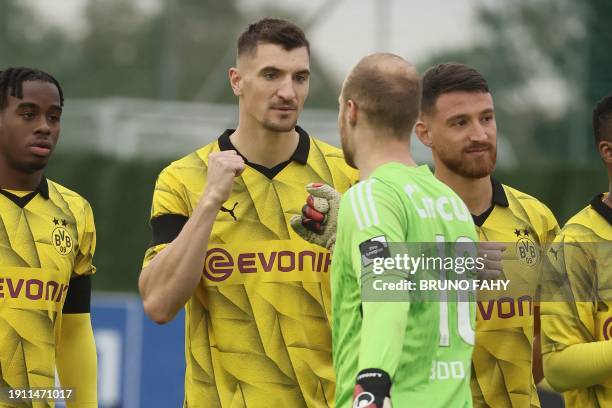 Dortmund's Thomas Meunier and Standard's goalkeeper Arnaud Bodart pictured at the start of a friendly soccer match between Standard de Liege and...