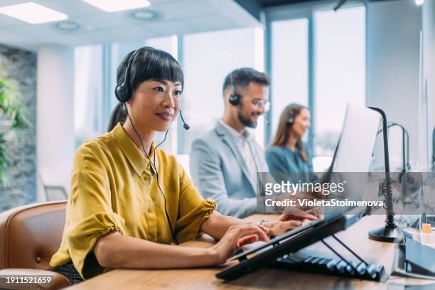 call center workers. - call centre stock pictures, royalty-free photos & images