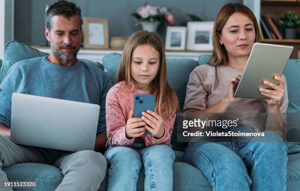 digital family. - family using computer stock pictures, royalty-free photos & images