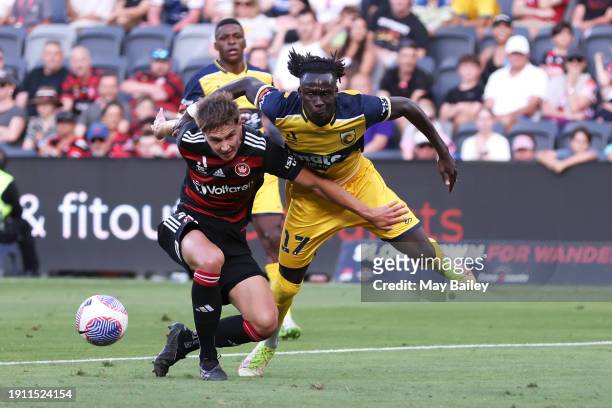 Alex Bonetig of the Wanderers and Jing Reec of the Mariners competes for the ball during the A-League Men round 11 match between Western Sydney...