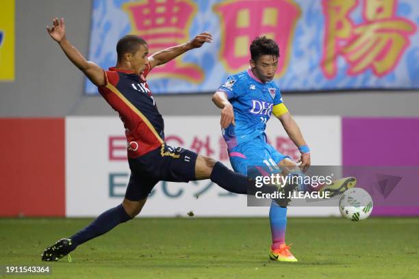 Kim Min-woo of Sagan Tosu controls the ball against Wellington Daniel Bueno of Kashima Antlers during the J.League J1 second stage match between...