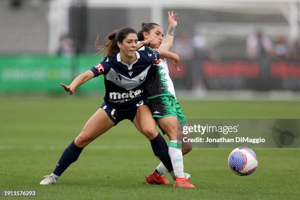 Mckenzie Weinert of Melbourne Victory and Stacey Papadopoulos of Western United contest for the ball during the A-League Women round 11 match between...