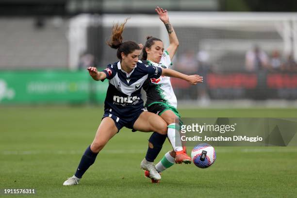 Mckenzie Weinert of Melbourne Victory and Stacey Papadopoulos of Western United contest for the ball during the A-League Women round 11 match between...
