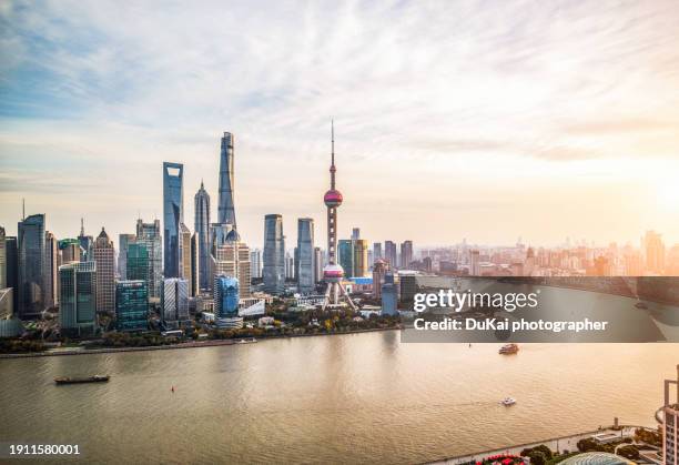 shanghai city skyline sunset - shanghai stock pictures, royalty-free photos & images