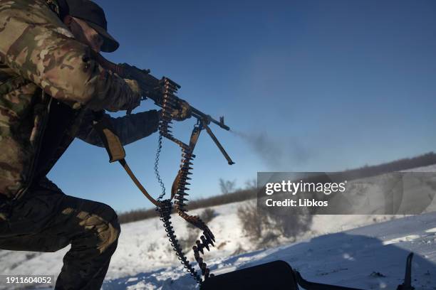Soldiers at the training ground calibrate their machine guns after going into combat on January 9, 2024 in Lyman district, Ukraine. Ukraine's 49th...