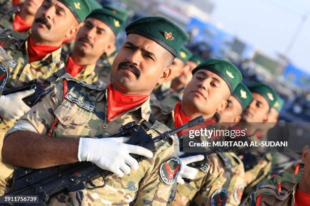 Rapid Response Forces parade during a ceremony marking the Police Day in Baghdad on January 9, 2024.