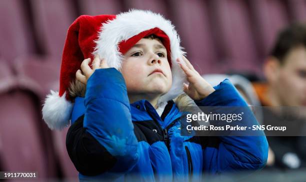 Young Hearts fan wears a Santa hat ahead of a cinch Premiership match between Heart of Midlothian and St Mirren at Tynecastle Park, on December 23 in...