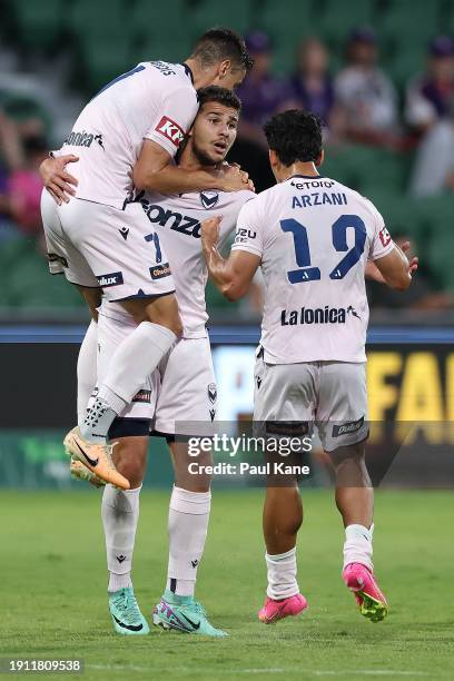 Zinedine Machach of the Victory celebrates a goal with Chris Ikonomidis and Daniel Arzani during the A-League Men round 11 match between Perth Glory...