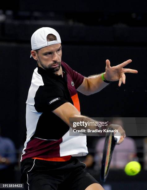 Grigor Dimitrov of Bulgaria plays a forehand in his semi final match against Jordan Thompson of Australia during day seven of the 2024 Brisbane...