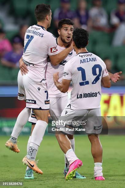 Zinedine Machach of the Victory celebrates a goal with Chris Ikonomidis and Daniel Arzani during the A-League Men round 11 match between Perth Glory...
