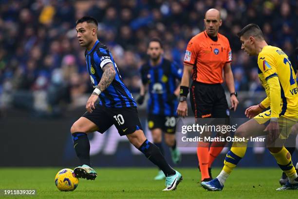 Lautaro Martinez of FC Internazionale, in action, scores their team's first goal during the Serie A TIM match between FC Internazionale and Hellas...