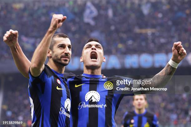 Lautaro Martinez of FC Internazionale celebrates with team mate Henrikh Mkhitaryan after scoring to give the side a 1-0 lead during the Serie A TIM...