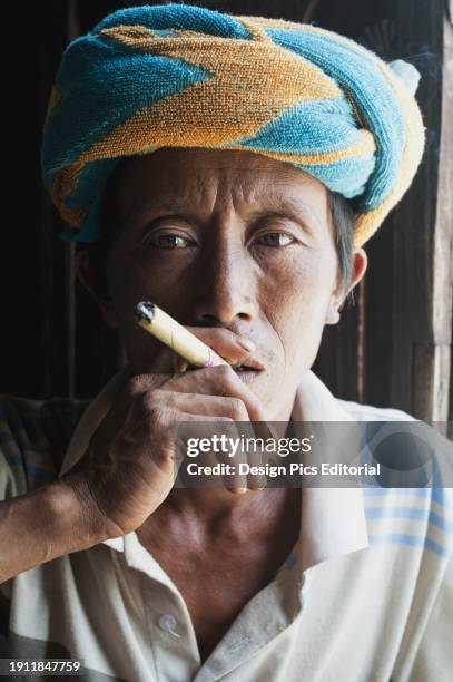 Man Smoking A Cigar. Myanmar.