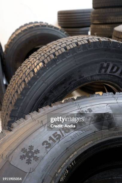 New tires in a car center: Continental winter tires for utility vehicles.