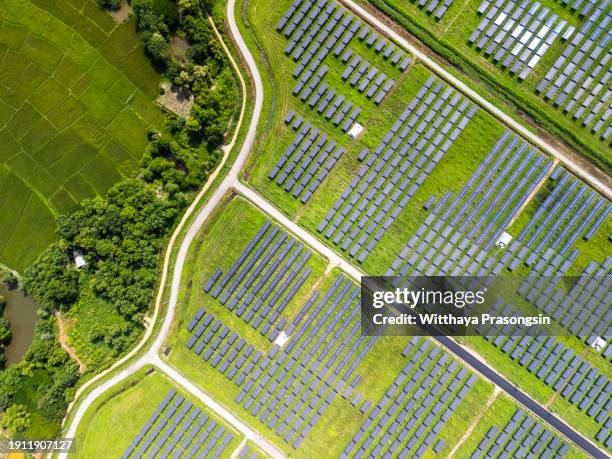 aerial view over solar cells energy farm in countryside landscape - lunar module stock pictures, royalty-free photos & images