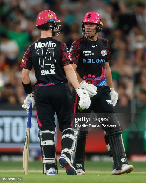 Jordan Silk of the Sixers and Moises Henriques of the Sixers celebrate during the BBL match between Melbourne Stars and Sydney Sixers at Melbourne...