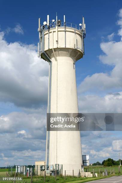 Mobile phone relay station on a water tower.