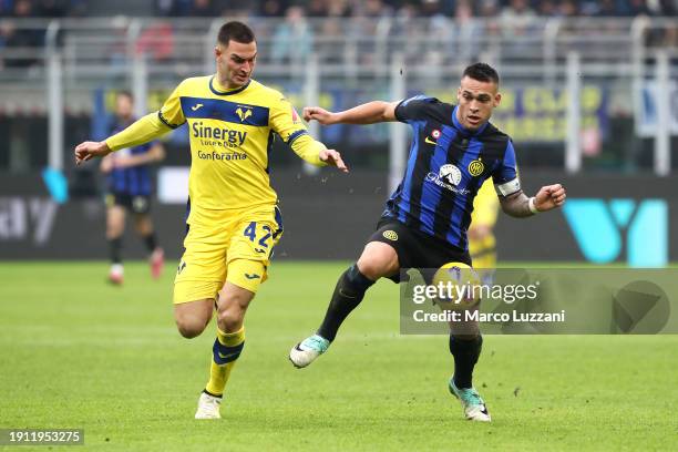 Diego Coppola of Hellas Verona FC battles for possession with Lautaro Martinez of FC Internazionale during the Serie A TIM match between FC...