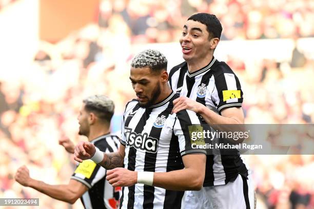 Joelinton of Newcastle United celebrates with Miguel Almiron of Newcastle United after scoring his team's first goal during the Emirates FA Cup Third...