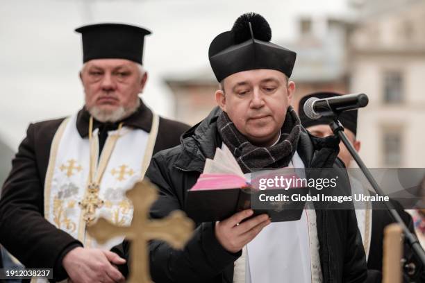 Priests of different confessions hold a joint prayer on Epiphany Day on Rynok Square in front of Lviv City Hall on January 6, 2024 in Lviv, Ukraine....